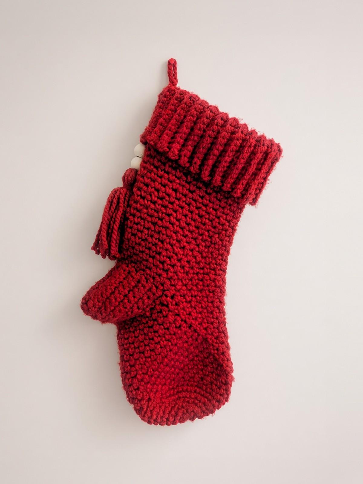 Red crochet Christmas stocking with ribbed cuff and tassel